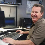 Peter working at a computer.